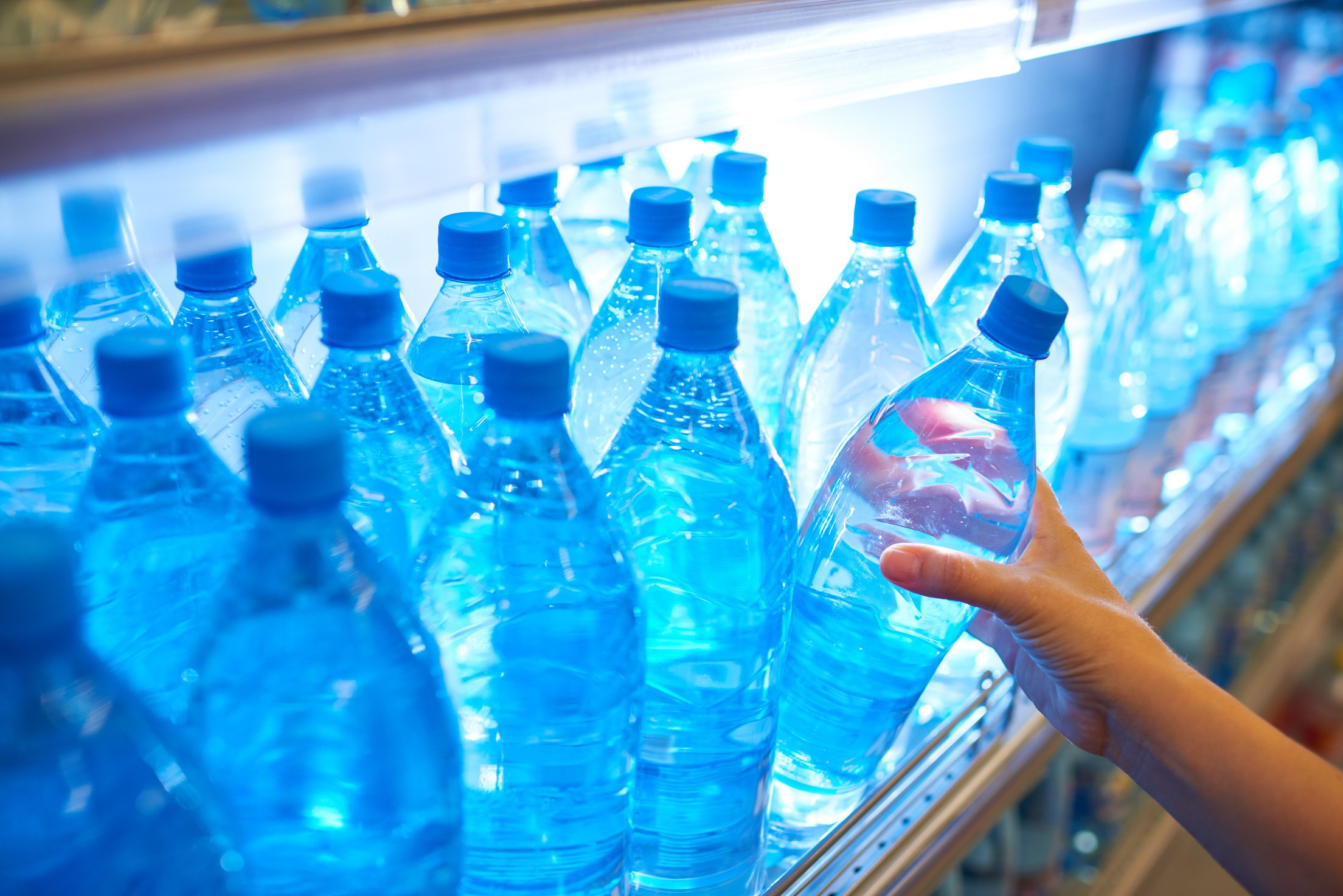 Bottled water on shelf in supermarket